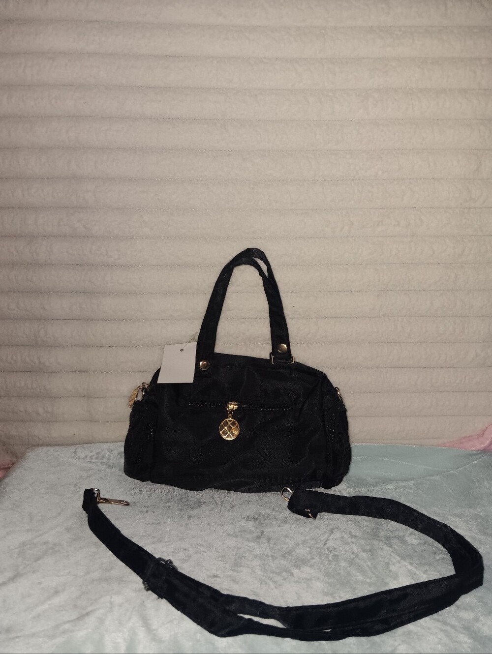 Versatile Black Shoulder Bag with Gold Charm